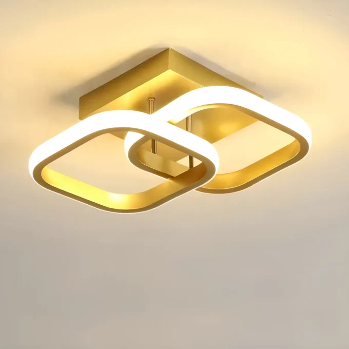 Detalhes da estrutura dourada e do sistema LED integrado da luminária de sobrepor Nitrolux Selene.